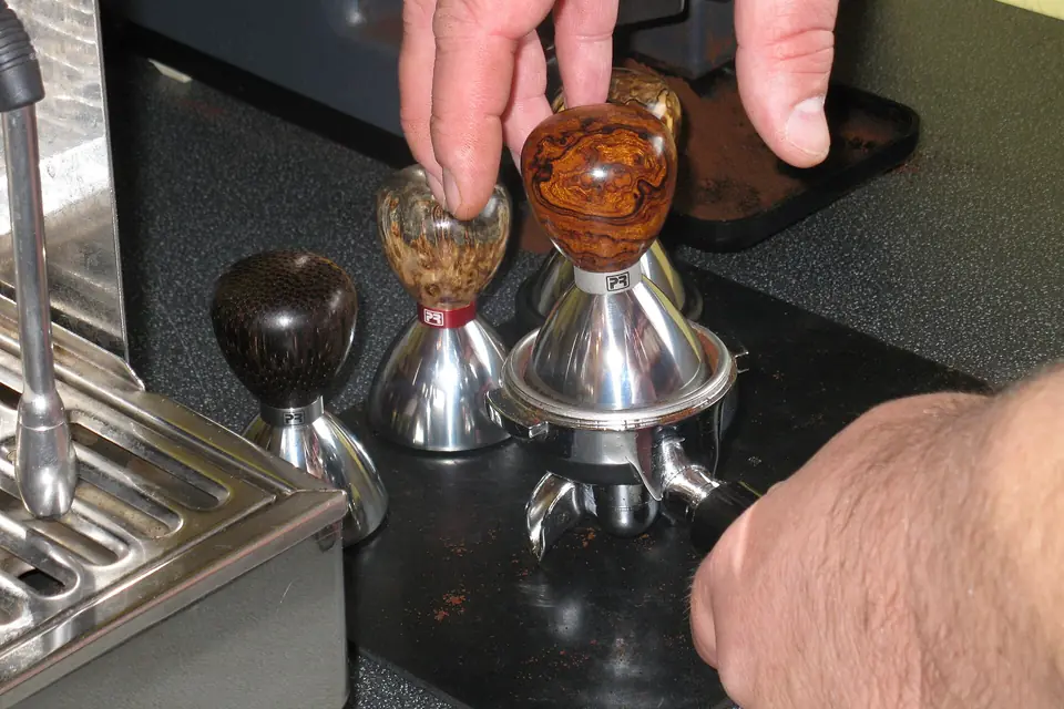 Espresso tampers on a tamping station