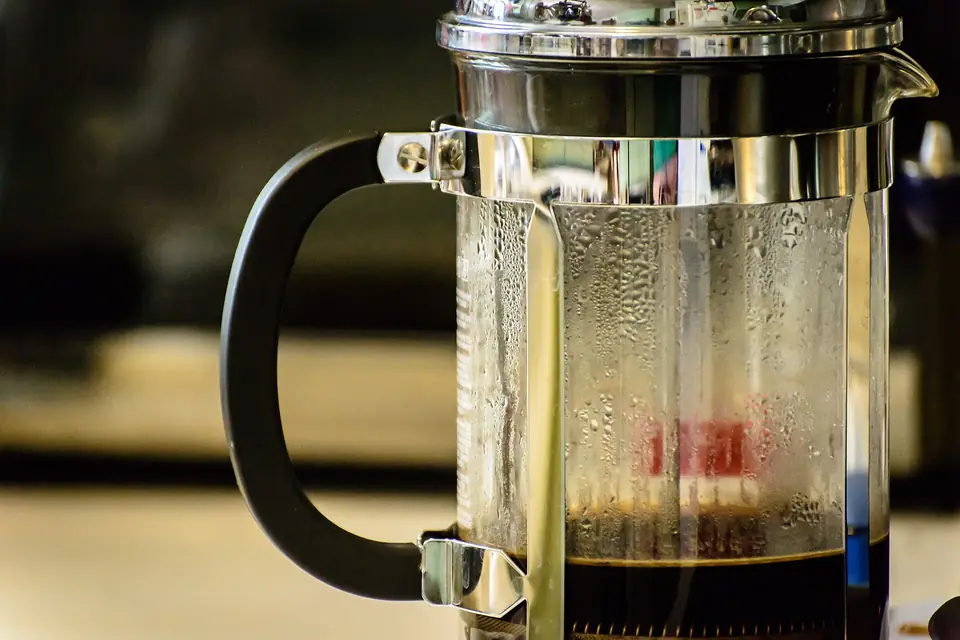 French press with coffee steeping