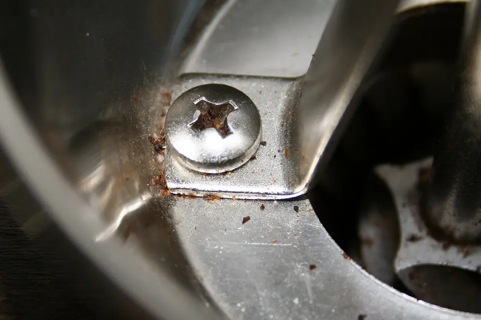 Close-up of a manual grinder's burr and hopper