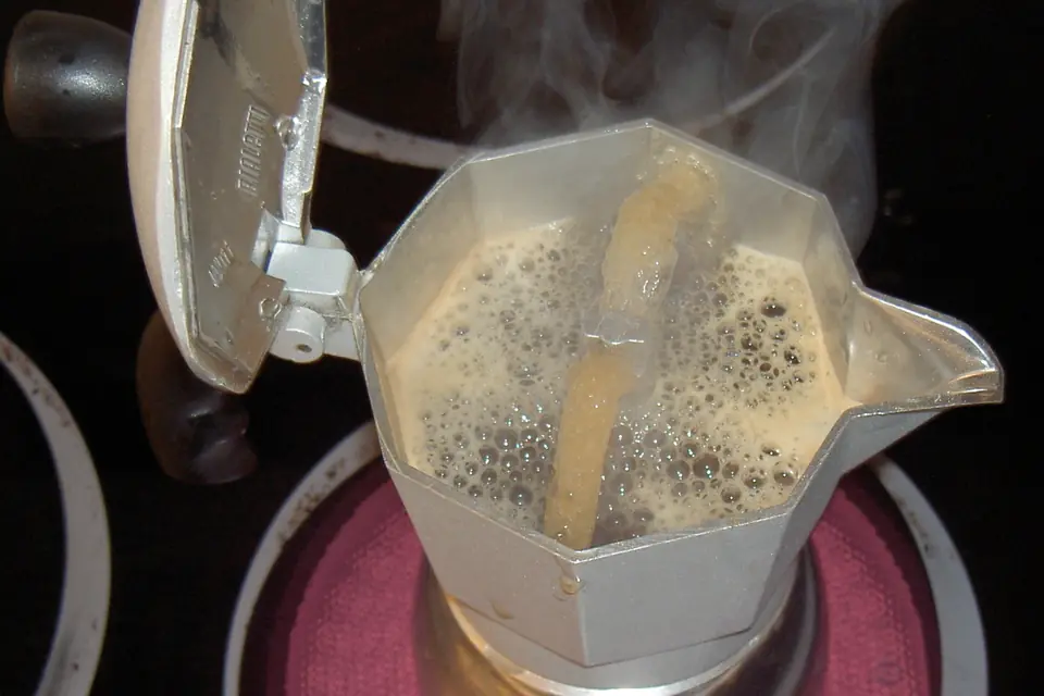 Moka pot brewing on a stovetop burner